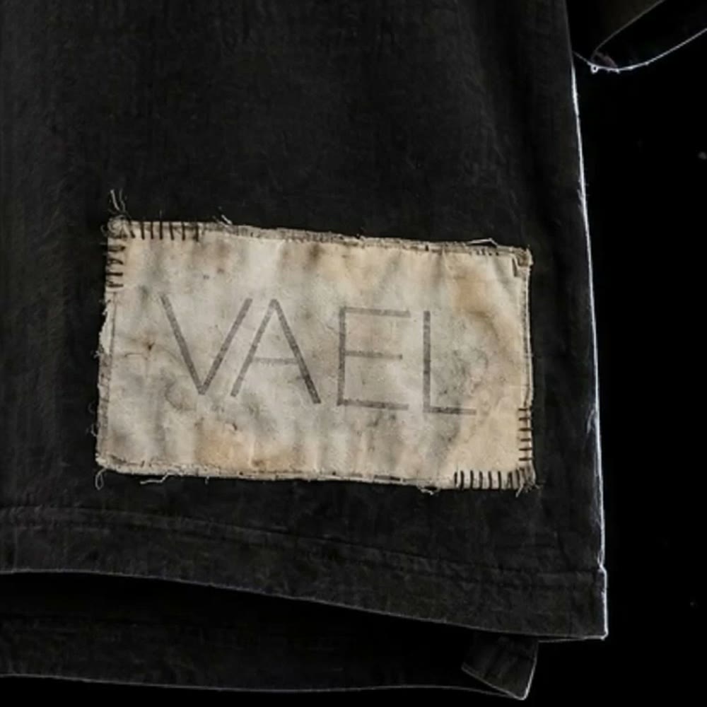 The VAEL patch at the hem, close up
