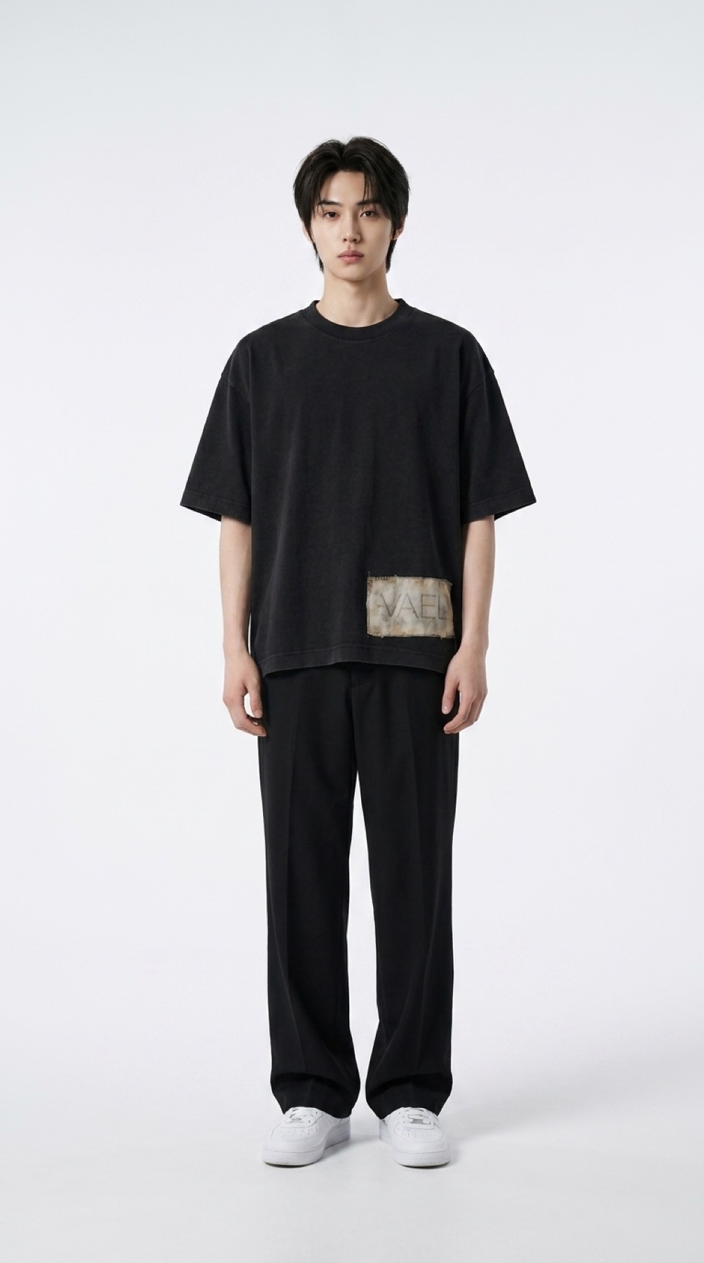Garment 001 in black, worn oversized